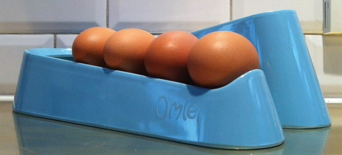 A blue egg ramp on a work surface