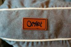 Omlet etiqueta cosida en el Fido Studio cama para perros