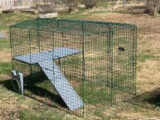 A rabbit enclosure with two platforms