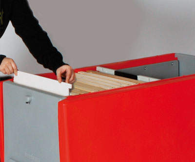 Person fitting dummy board in red Beehaus