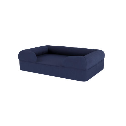 A dark blue memory foam bolster dog bed.