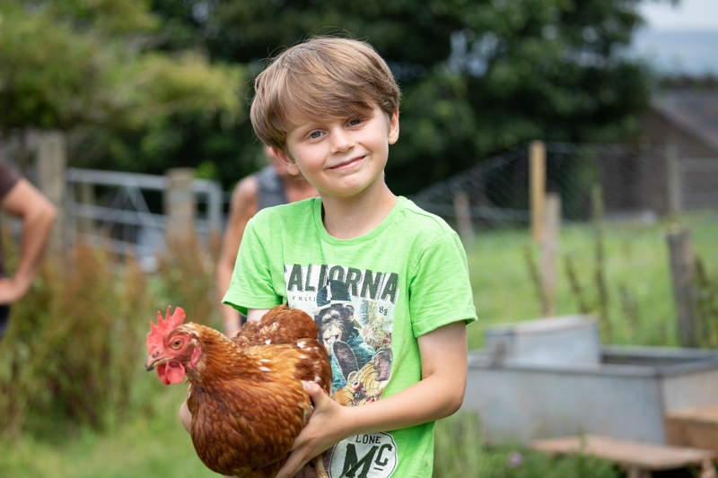 Child Holding Chicken