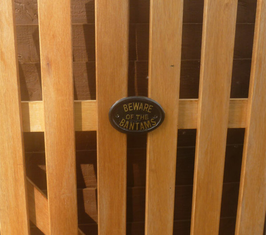 Beware of the bantams plaque hanging on gate